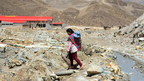 Woman with child in contaminated area in Huanuni, Bolivia